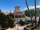 Charming Golden Vista Resort entrance with terra cotta roof and manicured greenery at 624 Hawk Eye Dr, Apache Junction, AZ 85119