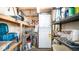 The storage room features shelving, stacked laundry units, and 'For Sale' signage at 624 Hawk Eye Dr, Apache Junction, AZ 85119