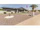 Welcoming house featuring minimalist desert landscaping, complemented by solar panels at 6456 E Dallas St, Mesa, AZ 85205