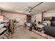 Cluttered garage with an array of storage cabinets and stored items at 6456 E Dallas St, Mesa, AZ 85205