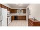 Bright kitchen with white appliances, functional layout, and plenty of cabinet storage at 6456 E Dallas St, Mesa, AZ 85205