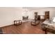 A view of the living room shows hardwood floors and an adjacent dining area with neutral wall color at 6456 E Dallas St, Mesa, AZ 85205