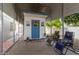 Covered patio features a charming shed with a blue door and outdoor seating for relaxation at 6456 E Dallas St, Mesa, AZ 85205