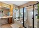 Luxurious bathroom featuring a glass-enclosed shower and a relaxing soaking tub at 6795 S Sapphire Way, Chandler, AZ 85249