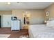 Bright bedroom with a white dresser, neutral walls and carpet, and a walk-in closet and bathroom at 6795 S Sapphire Way, Chandler, AZ 85249