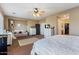 Spacious bedroom featuring a king bed, sitting area with sofa, and a ceiling fan at 6795 S Sapphire Way, Chandler, AZ 85249