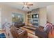 Cozy living room featuring a stone fireplace and neutral decor at 6795 S Sapphire Way, Chandler, AZ 85249