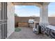 Outdoor kitchen with a built-in BBQ grill, countertop space, and a brick privacy wall at 6795 S Sapphire Way, Chandler, AZ 85249