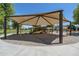 Covered playground featuring slides, climbing structures, and swings, offering a fun and shaded outdoor experience at 6795 S Sapphire Way, Chandler, AZ 85249