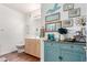 Charming bathroom with decorative blue cabinet, framed art, white walls, and modern fixtures at 7401 W Arrowhead Clubhouse Dr # 2079, Glendale, AZ 85308