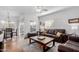 Cozy living room with hardwood floors, neutral tones, and a ceiling fan, creating a warm atmosphere at 7401 W Arrowhead Clubhouse Dr # 2079, Glendale, AZ 85308