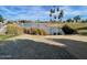 View of the pond with bulrushes and palm trees in the background at 7401 W Arrowhead Clubhouse Dr # 2079, Glendale, AZ 85308