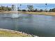 Scenic view of the tranquil pond with a fountain as the focal point at 7401 W Arrowhead Clubhouse Dr # 2079, Glendale, AZ 85308