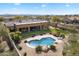 Aerial view of backyard featuring custom pool, landscaping and covered patio at 7848 E Parkview Ln, Scottsdale, AZ 85255