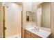 Bright bathroom with single sink vanity and glass door shower stall at 7848 E Parkview Ln, Scottsdale, AZ 85255