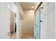 Neutral bathroom with glass door shower stall, tile floor and light wood cabinets at 7848 E Parkview Ln, Scottsdale, AZ 85255