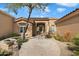 A home with a stone pathway leading to a covered front entrance at 7848 E Parkview Ln, Scottsdale, AZ 85255