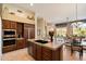 Gorgeous kitchen island with dual sinks, seating, and stainless appliances at 7848 E Parkview Ln, Scottsdale, AZ 85255