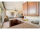 Cozy wet bar and living area with granite countertops and natural light at 7848 E Parkview Ln, Scottsdale, AZ 85255