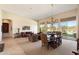 An open-concept living room and dining room with natural light and backyard views at 7848 E Parkview Ln, Scottsdale, AZ 85255