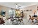 Dining area with a ceiling fan, tile flooring, and a round table with seating for four at 8230 E Valley Vista Dr, Scottsdale, AZ 85250