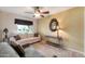 Comfortable living room area, featuring a sofa and a large window for natural light at 8230 E Valley Vista Dr, Scottsdale, AZ 85250