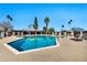 Community swimming pool featuring a spacious deck area, several seating areas, and clear blue water on a sunny day at 8230 E Valley Vista Dr, Scottsdale, AZ 85250