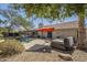 Private backyard featuring a pool, hot tub, covered patio, and mature trees at 8984 E Sutton Dr, Scottsdale, AZ 85260