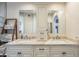 Well-lit bathroom with dual sinks, classic cabinetry, and ample counter space for morning routines at 8984 E Sutton Dr, Scottsdale, AZ 85260