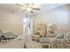 Inviting bedroom with a daybed, vanity, and seating area, creating a cozy retreat at 8984 E Sutton Dr, Scottsdale, AZ 85260