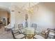 Formal dining room featuring designer lighting and access to adjacent living spaces at 8984 E Sutton Dr, Scottsdale, AZ 85260