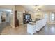 Inviting living room with a fireplace, ceiling fan, and comfortable seating at 8984 E Sutton Dr, Scottsdale, AZ 85260