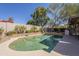 Inviting backyard pool with mature landscaping offers a serene escape at 8984 E Sutton Dr, Scottsdale, AZ 85260