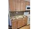 A detailed view of the kitchen's wood cabinetry, tile backsplash, and beautiful granite countertops at 904 Leisure World --, Mesa, AZ 85206