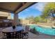 Outdoor living space with pool, barbecue, and patio seating area at 9576 E Kiisa Dr, Scottsdale, AZ 85262