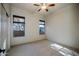 Bright bedroom with carpet, a ceiling fan, and windows with natural light at 9576 E Kiisa Dr, Scottsdale, AZ 85262