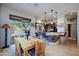 Bright kitchen featuring bar seating, pendant lights, and a rustic wooden table at 9576 E Kiisa Dr, Scottsdale, AZ 85262