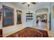 Bright sitting room with hardwood floors, a decorative rug, and view to the kitchen at 9576 E Kiisa Dr, Scottsdale, AZ 85262