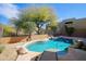 Private pool area surrounded by mature trees and desert landscaping, perfect for relaxation at 9576 E Kiisa Dr, Scottsdale, AZ 85262