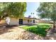 Well-manicured backyard with a covered patio, perfect for outdoor entertaining at 10008 N 50Th Dr, Glendale, AZ 85302