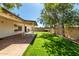Lush backyard with a covered patio and well-maintained lawn, ideal for relaxation at 10008 N 50Th Dr, Glendale, AZ 85302