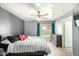 Cozy bedroom with a ceiling fan, slider to the backyard, and neutral colors offer a tranquil retreat at 10008 N 50Th Dr, Glendale, AZ 85302
