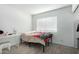 Bright bedroom with ample natural light, neutral walls and sleek gray flooring at 10008 N 50Th Dr, Glendale, AZ 85302