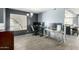 Comfortable home office setup with neutral walls, natural light and sleek flooring at 10008 N 50Th Dr, Glendale, AZ 85302