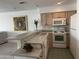 Functional kitchen with laminate countertops, white appliances, and tiled flooring at 10080 E Mountain View Lake Dr # 138, Scottsdale, AZ 85258