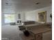 Open-concept living room boasts plush seating, lake view window, and decorative fireplace at 10080 E Mountain View Lake Dr # 138, Scottsdale, AZ 85258