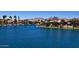 Scenic waterfront view featuring calm water, waterfront homes and a mountain backdrop at 10080 E Mountain View Lake Dr # 138, Scottsdale, AZ 85258