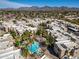Beautiful aerial view of complex featuring swimming pool, palm trees, and mountain views at 11333 N 92Nd St # 2072, Scottsdale, AZ 85260