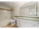 A full bathroom with a tub and shower, toilet, tile floor, vanity with cabinet, and a large mirror at 11333 N 92Nd St # 2072, Scottsdale, AZ 85260