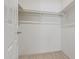 Bright closet with neutral walls and carpet, and metal rails for easy clothing storage at 11333 N 92Nd St # 2072, Scottsdale, AZ 85260